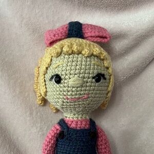 crocheted doll with blonde curly hair